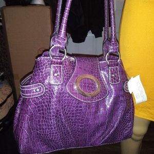 Purple embossed handbag